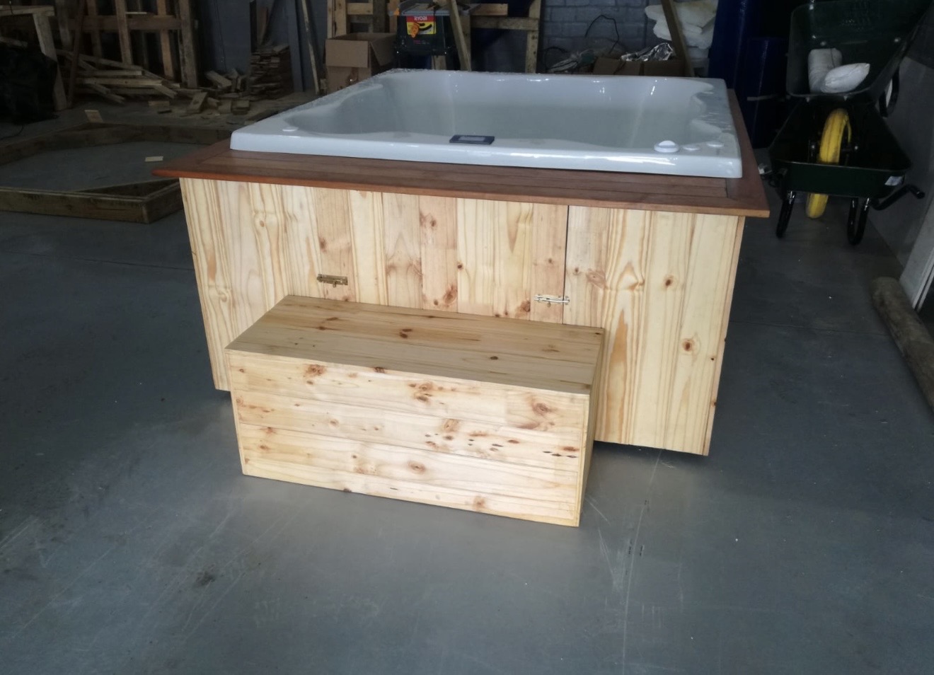 Completed jacuzzi unit with pine cladding and matching step